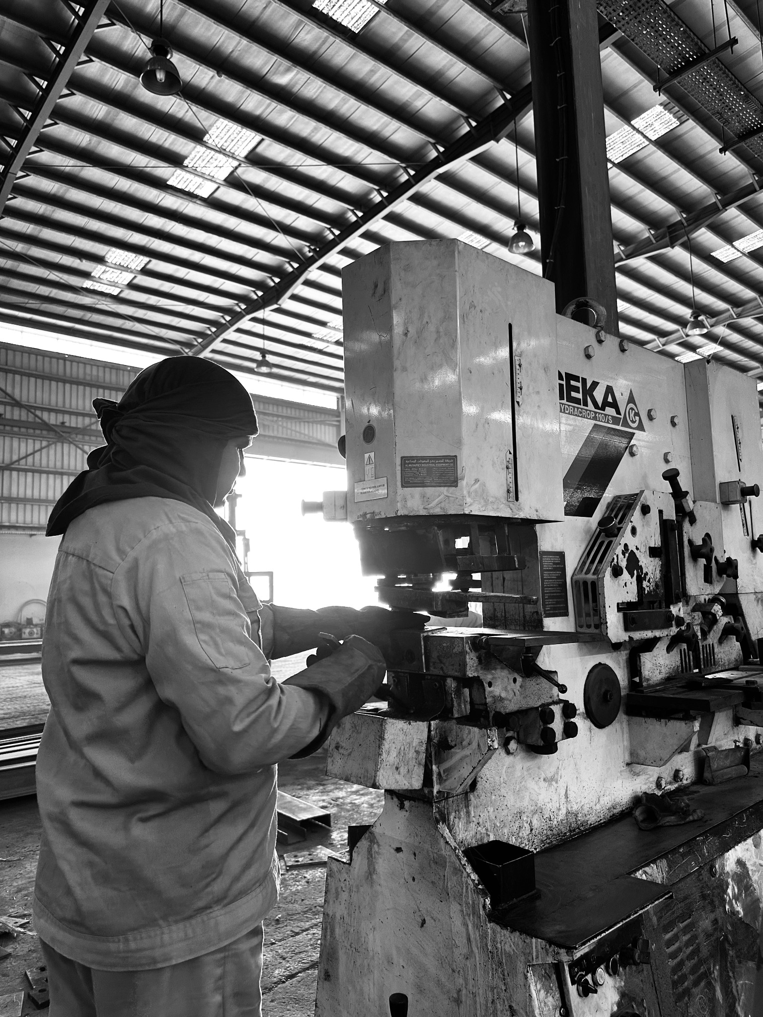 Worker operating a workshop machine