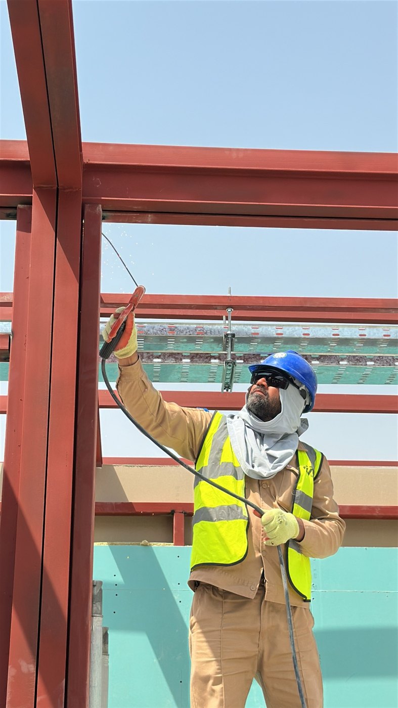 Worker carrying out work on a steel frame